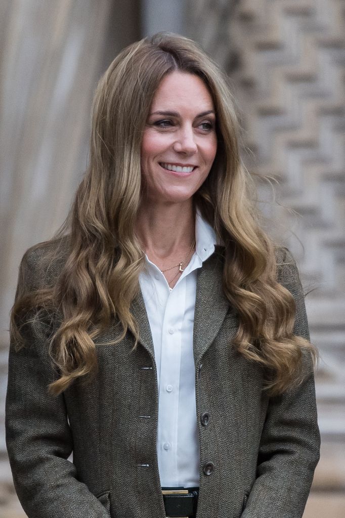 Kate Middleton smiling with blonde curls