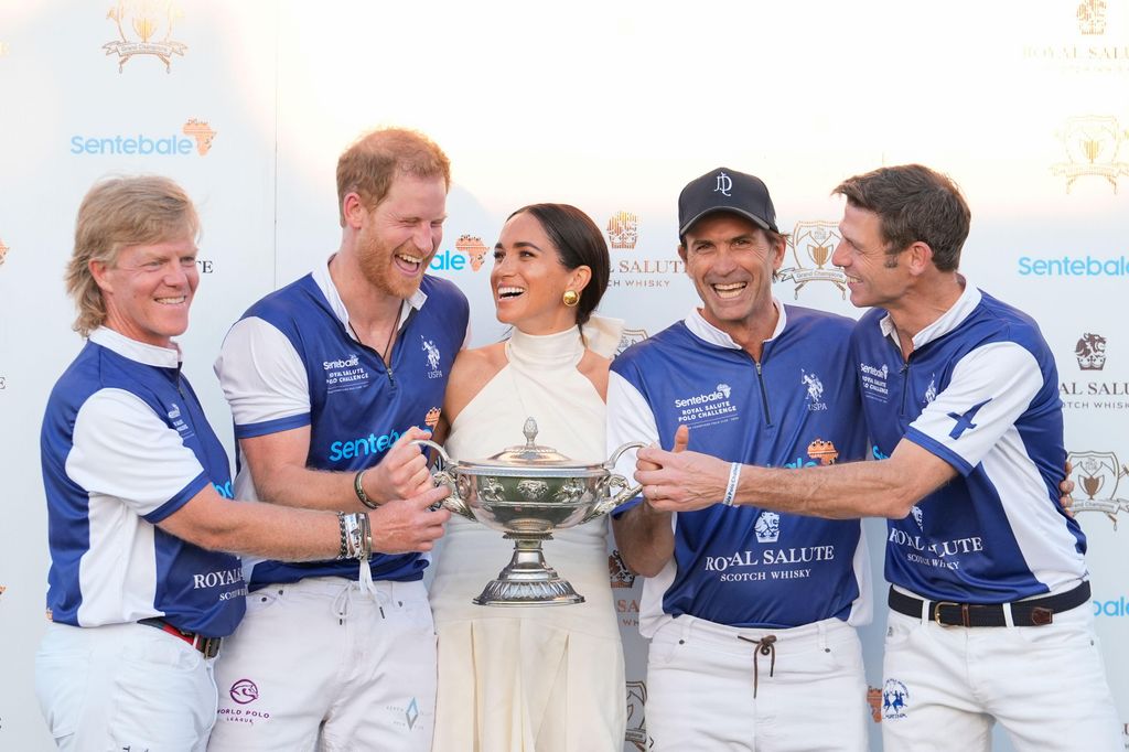 The couple laugh together as Meghan presents him and his polo teammates with the trophy for winning the 2024 Royal Salute Polo Challenge to Benefit Sentebale