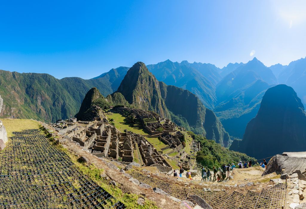 Machu Picchu is a 15th-century Inca site located 2,430 metres above sea level on a mountain ridge above the Urubamba Valley.