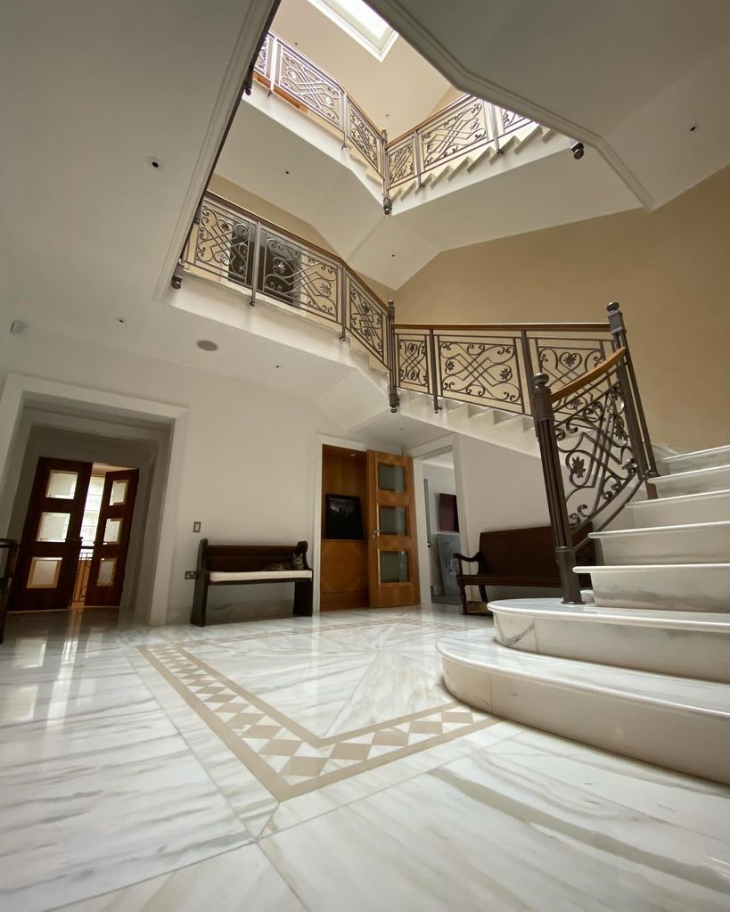 marble entryway with two staircases