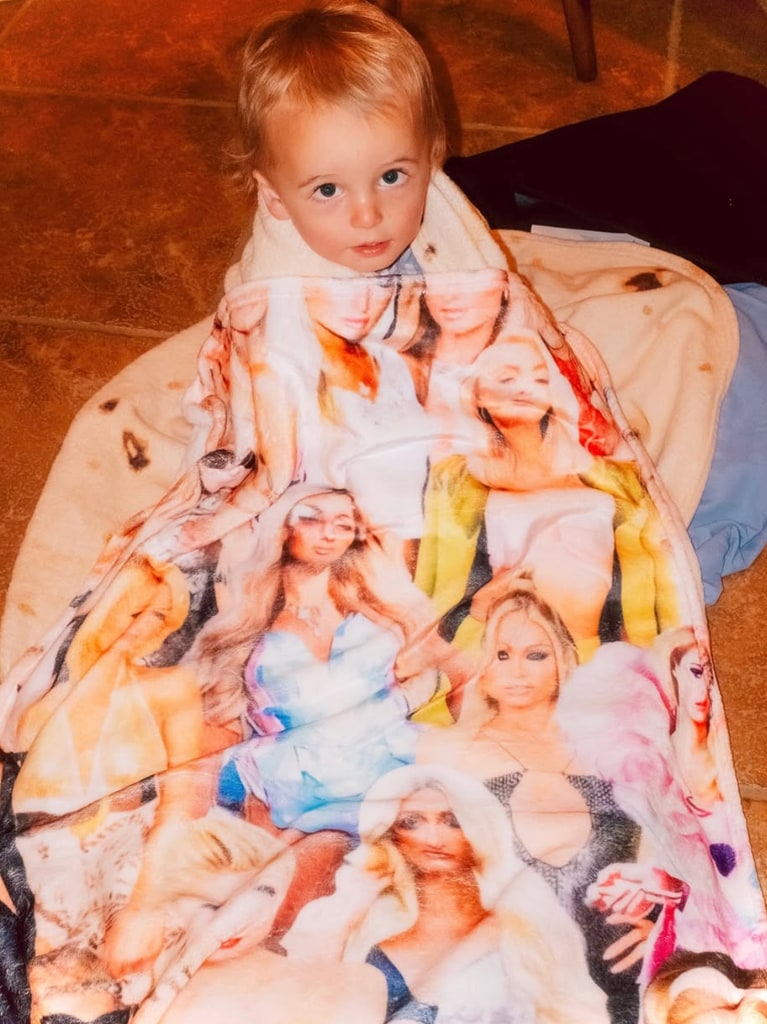 Photo shared by Paris Hilton of her son Phoenix wrapped in a blanket with several photos of her printed on it