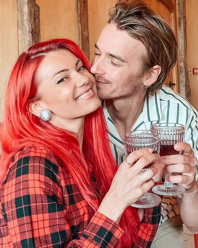 Joe Buswell and Dianne Buswell smiling at each pther 