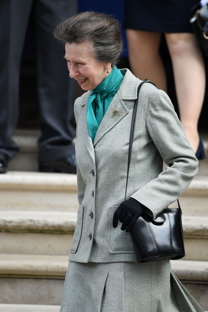 Princess Anne wore in teal silky shirt and skirt suit