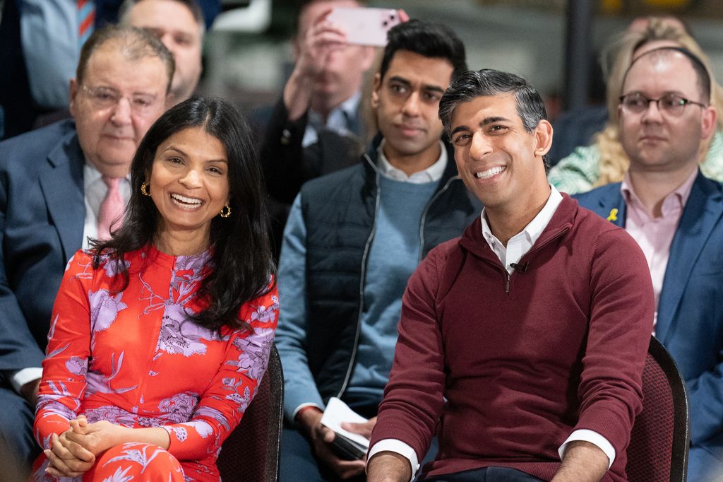 Prime Minister Rishi Sunak sits with his wife Akshata Murty, during a Q&A event at the RAF Museum in Hendon, as he launches an employment plan which pledges to help veterans secure high-paid jobs after they leave the armed forces on April 12, 2024 in London, England