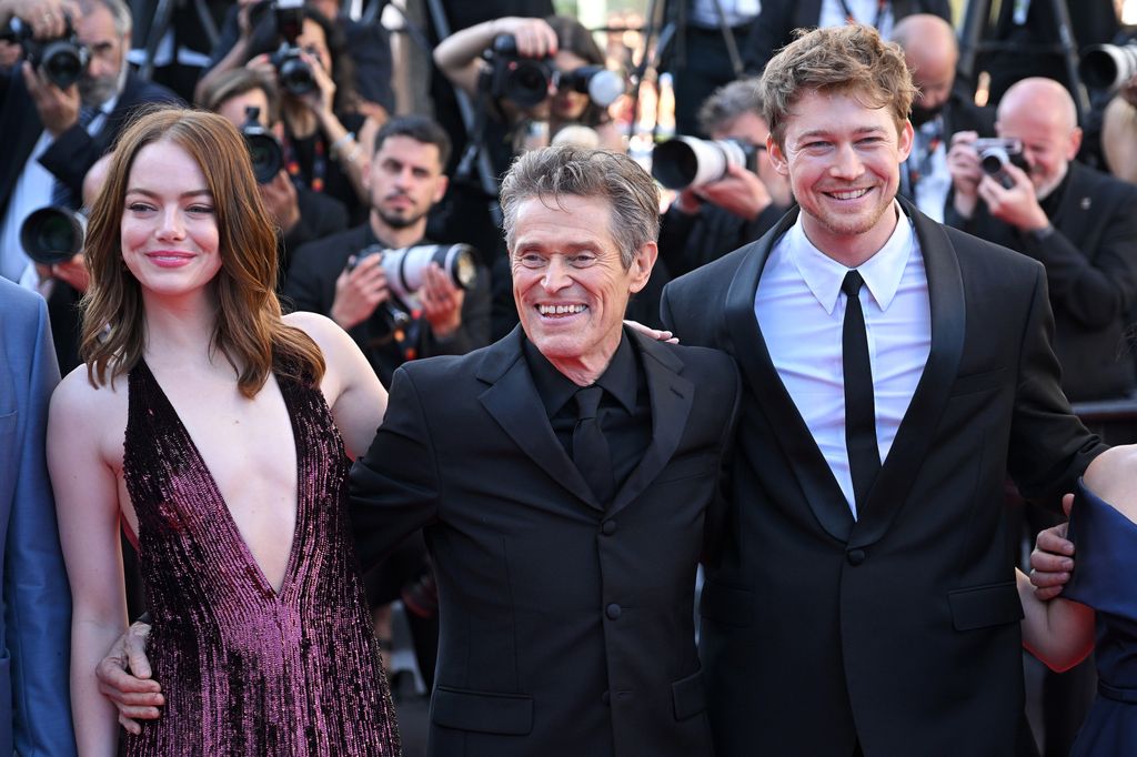 Emma Stone, Willem Dafoe and Joe Alwyn attend the "Kinds Of Kindness" Red Carpet at the 77th annual Cannes Film Festival 
