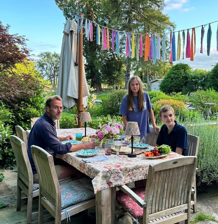 Ben and his two children enjoying an alfresco dinner