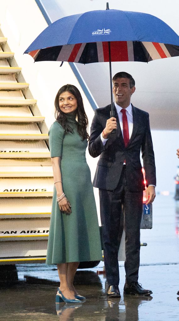 Britain's Prime Minister Rishi Sunak (R) and his wife Akshata Murthy arrive at Hiroshima airport in Mihara, Hiroshima prefecture on May 18, 2023, to attend the G7 Leaders' Summit. (Photo by Stefan Rousseau / POOL / AFP) (Photo by STEFAN ROUSSEAU/POOL/AFP via Getty Images)