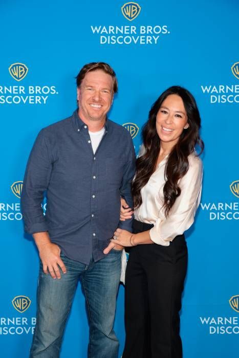 joanna gaines linking arms with husband chip gaines