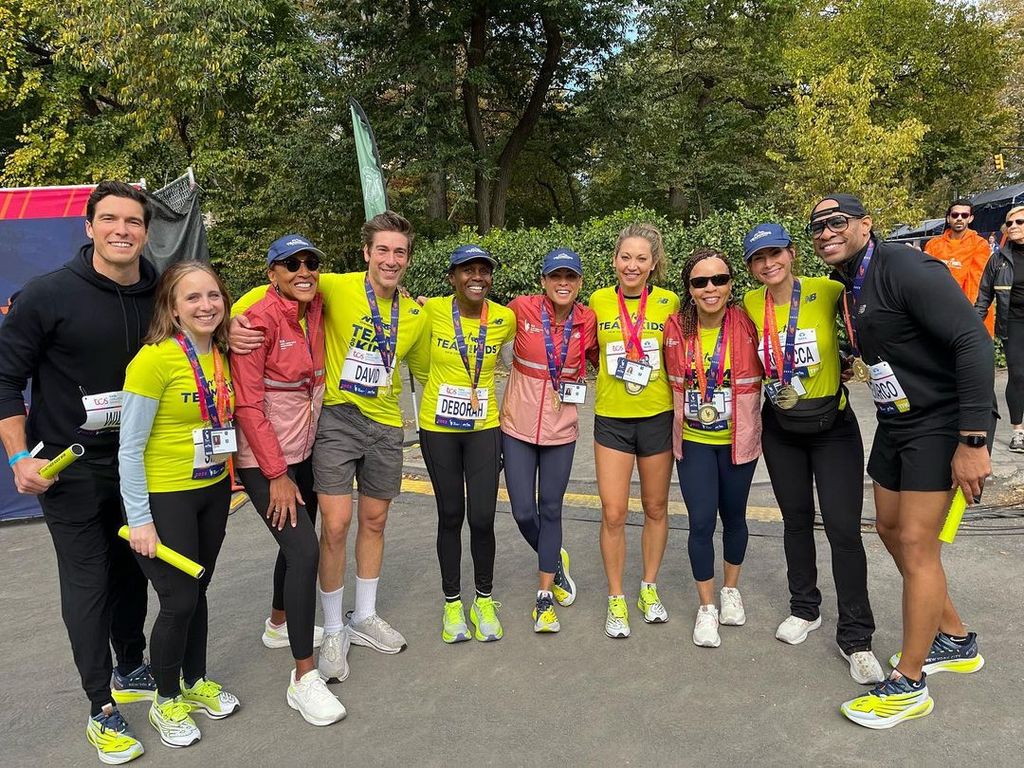 David Muir looked sporty as he posed with his fellow ABC relay team at the New York Marathon