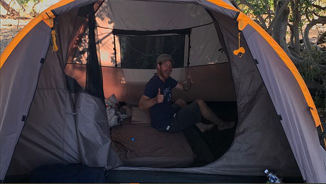 Harry in a tent in Botswana