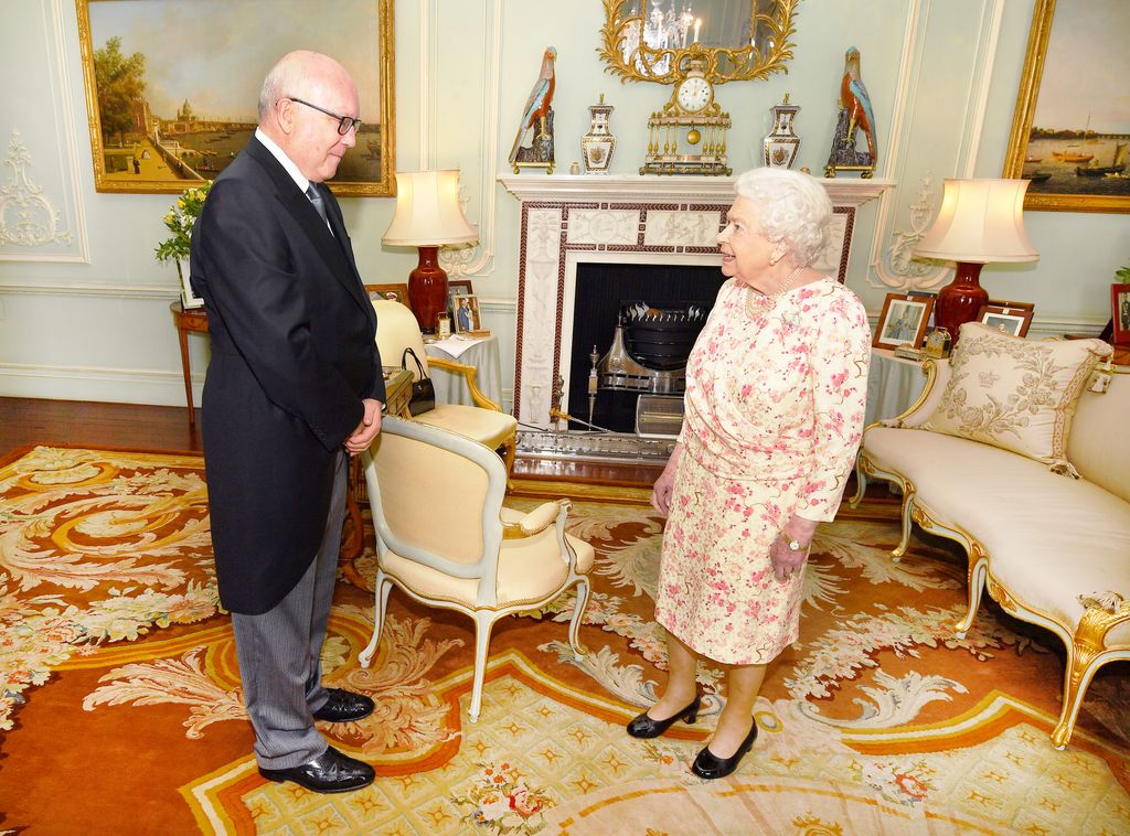 Queen Elizabeth II with the Honorable George Brandis in palace room