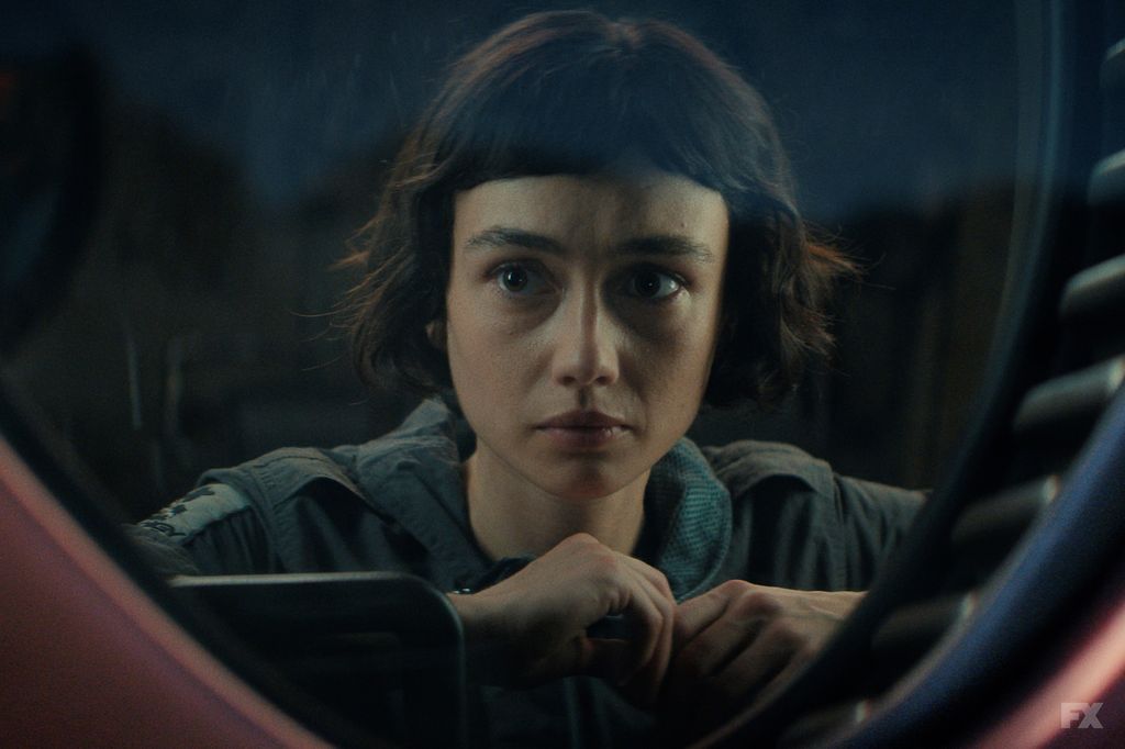 close-up of young woman in grey jumpsuit