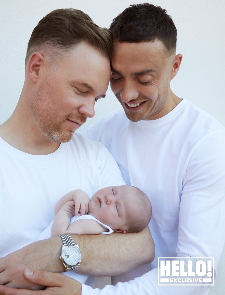 Stuart and Francis cradle their newborn baby