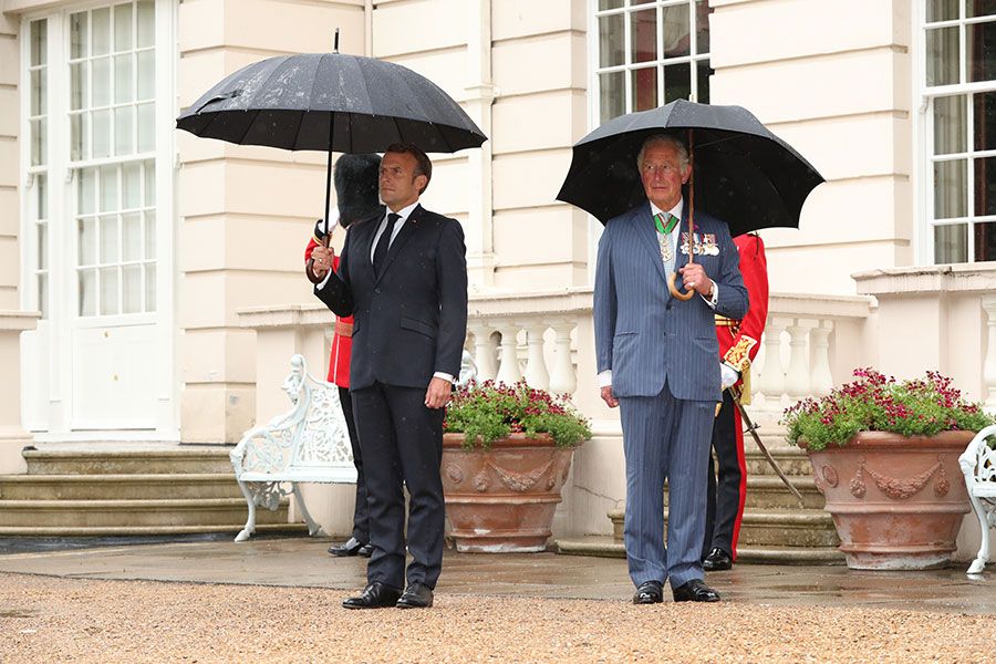 prince charles stands next to macron