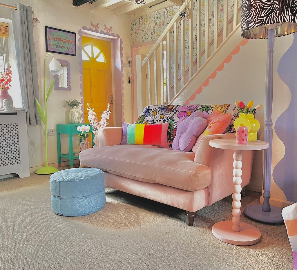 pink sofa in lounge with pastel decor