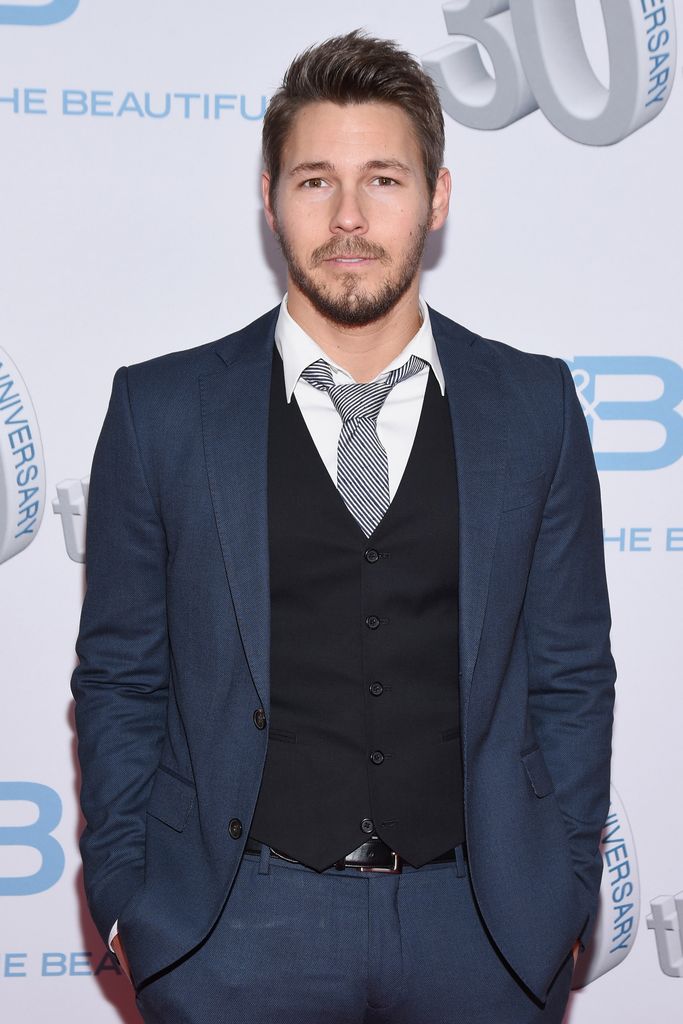 Scott Clifton in a blue suit