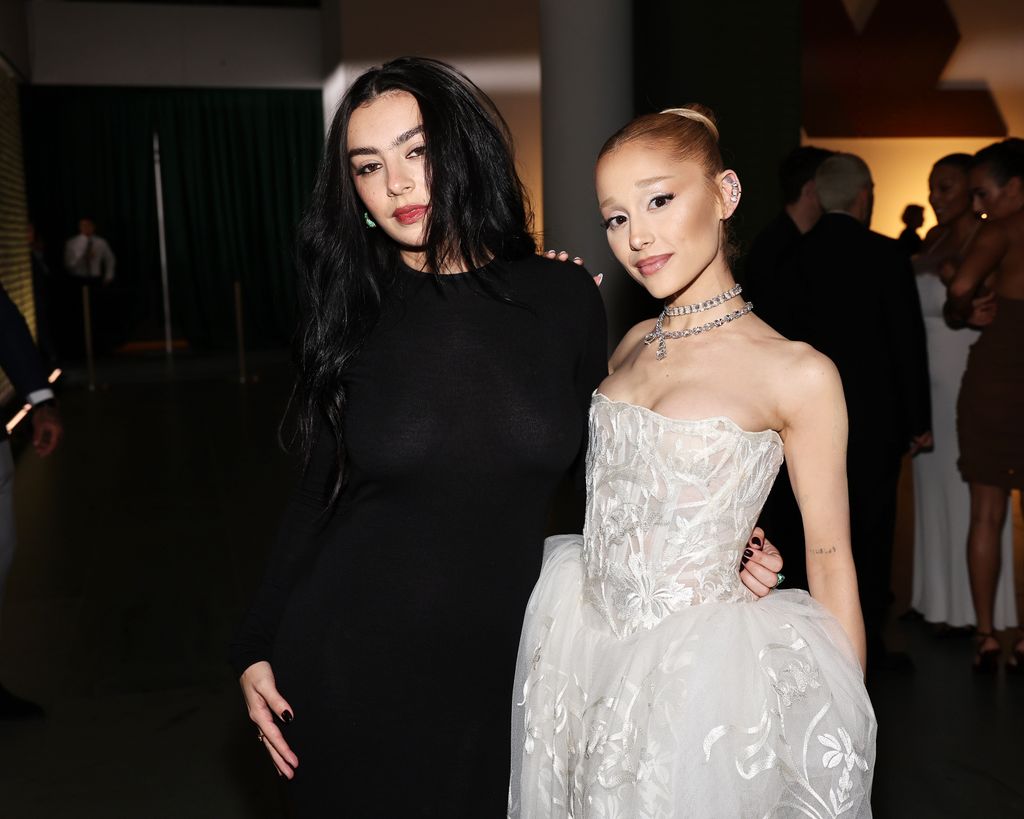 Charli XCX and Ariana Grande posing together in dresses