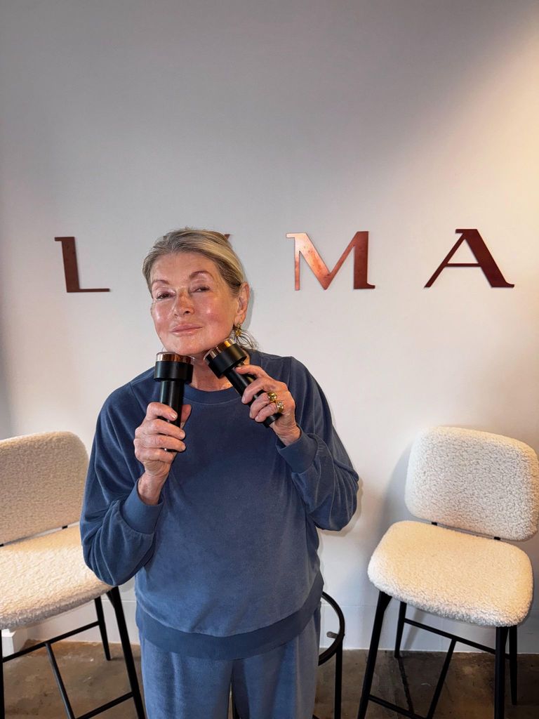Martha posing with the LYMA Laser PRO device