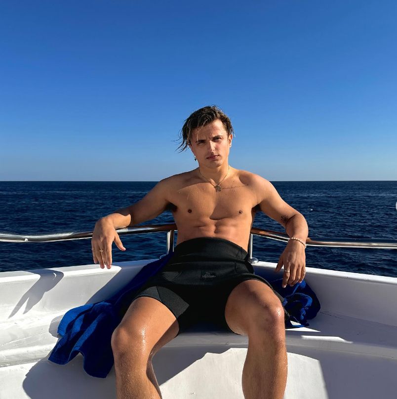 Nikita Kuzmin shirtless on a boat