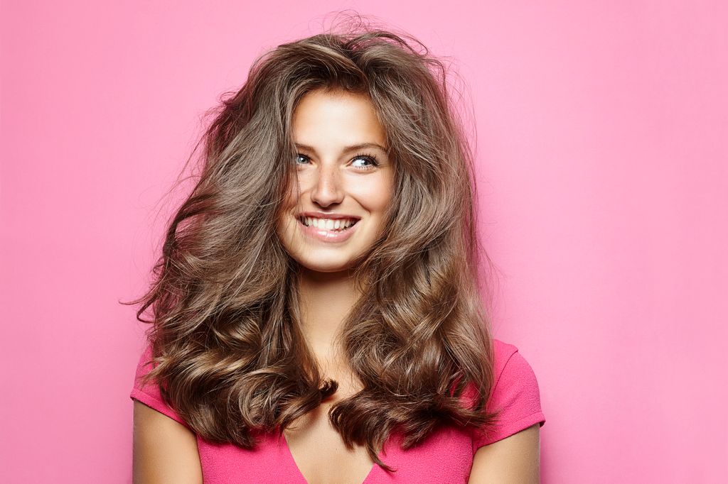 How to stop hair loss - woman with thick hair