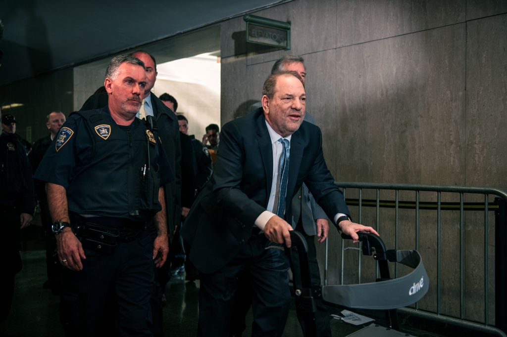 Movie producer Harvey Weinstein (R) enters New York City Criminal Court on February 24, 2020 in New York City