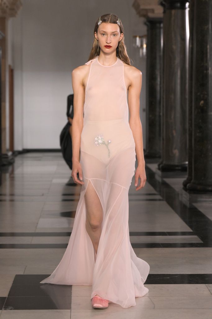 Simone Rocha spring/summer 2025 runway model in sheer pink dress