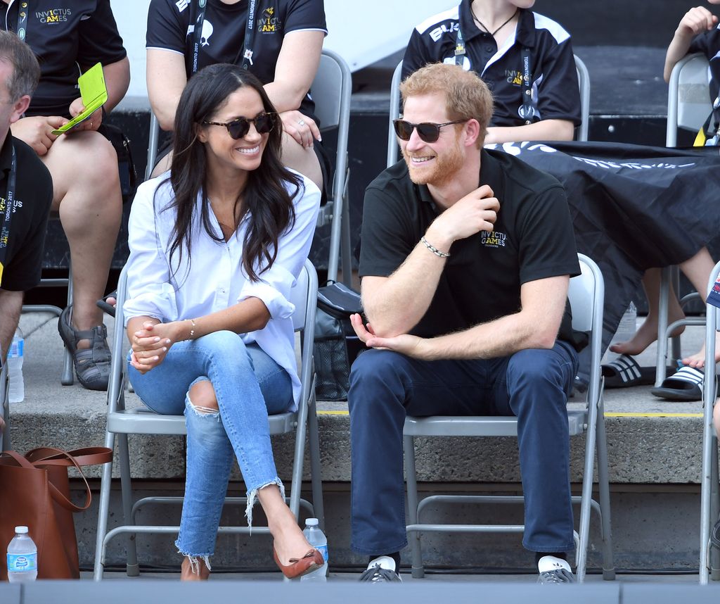 Harry and Meghan smiling together at the Invictus Games Toronto 2017
