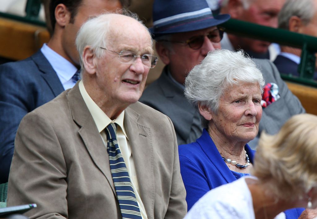 old couple watching tennis at wimbledon