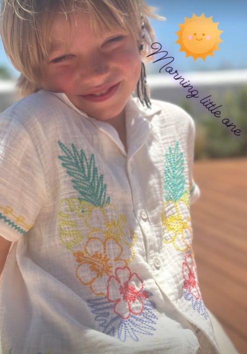 A young boy in a white shirt