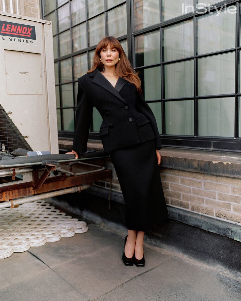 Elizsbeth Olsen in a black power suit