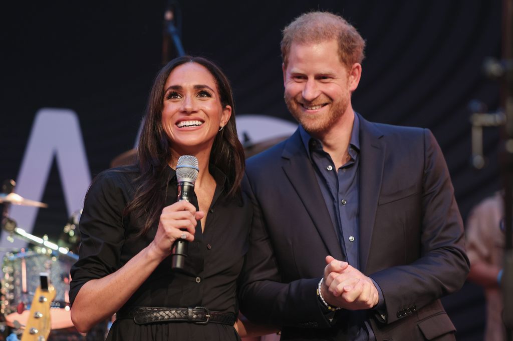 Harry and Meghan on stage at the Friends @ Home Event in Dusseldorf