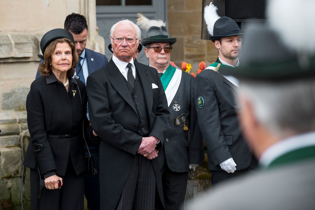 Queen Silvia of Sweden and Swedish King Carl XVI Gustaf stand on the palace square during the funeral service for Prince Andreas of Saxe-Coburg and Gotha
