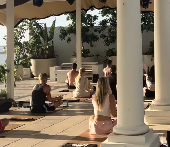 group of people meditating 