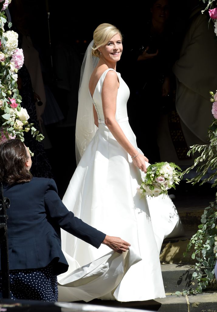 Declan Donnelly's bride Ali Astall looking over her shoulder in a wedding dress