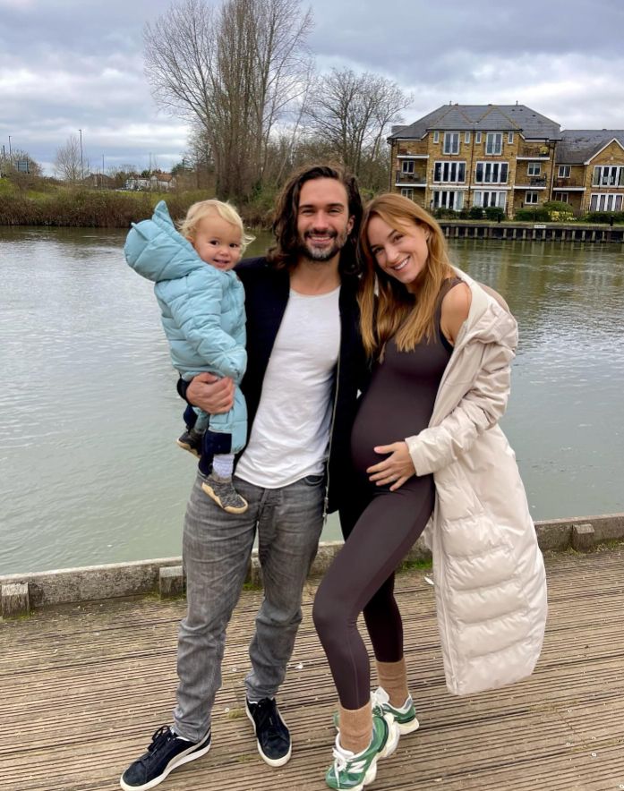 Joe Wicks with a pregnant woman and a young girl