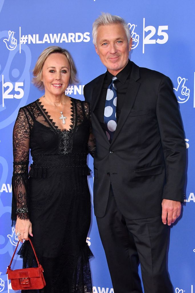 Shirlie and Martin Kemp wearing black and posing on the red carpet