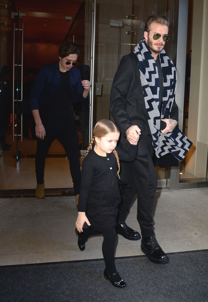 Harper wore all black with braided hair and shiny shoes, walking beside David Beckham in a patterned scarf and black coat. Her sleek, stylish look was perfect for the winter weather.