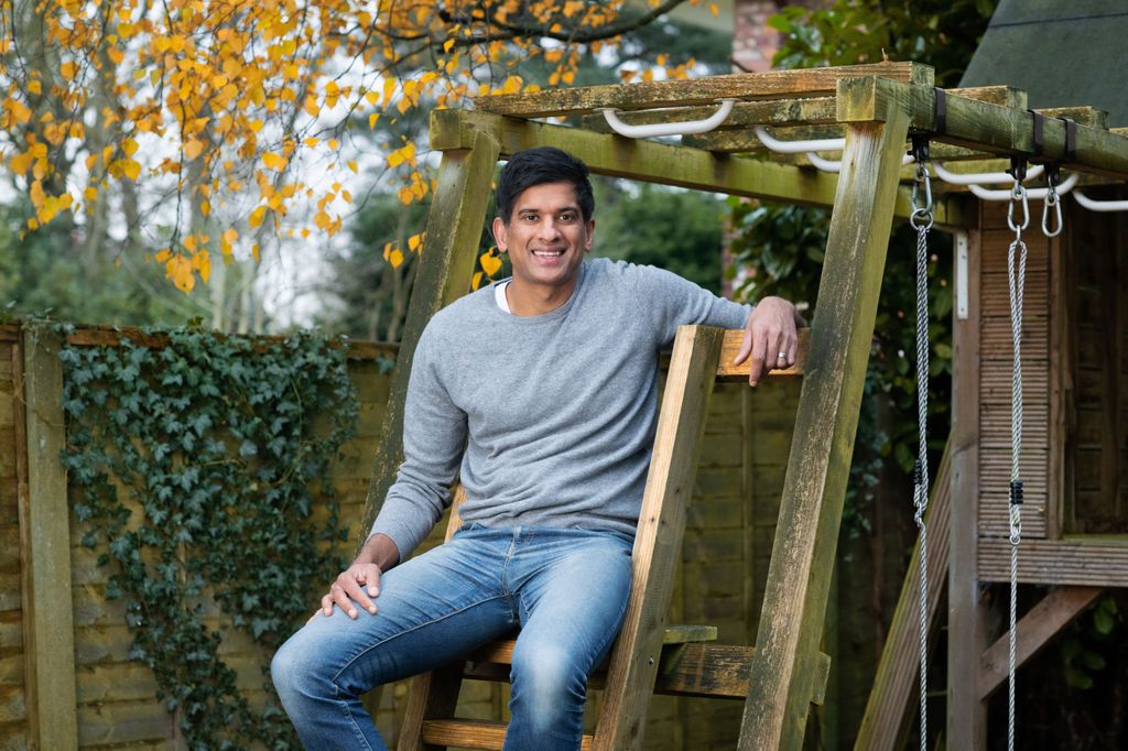 man leaning on a climbing frame