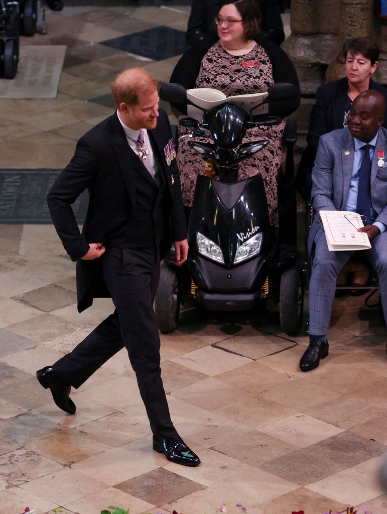 Prince Harry walking to his seat