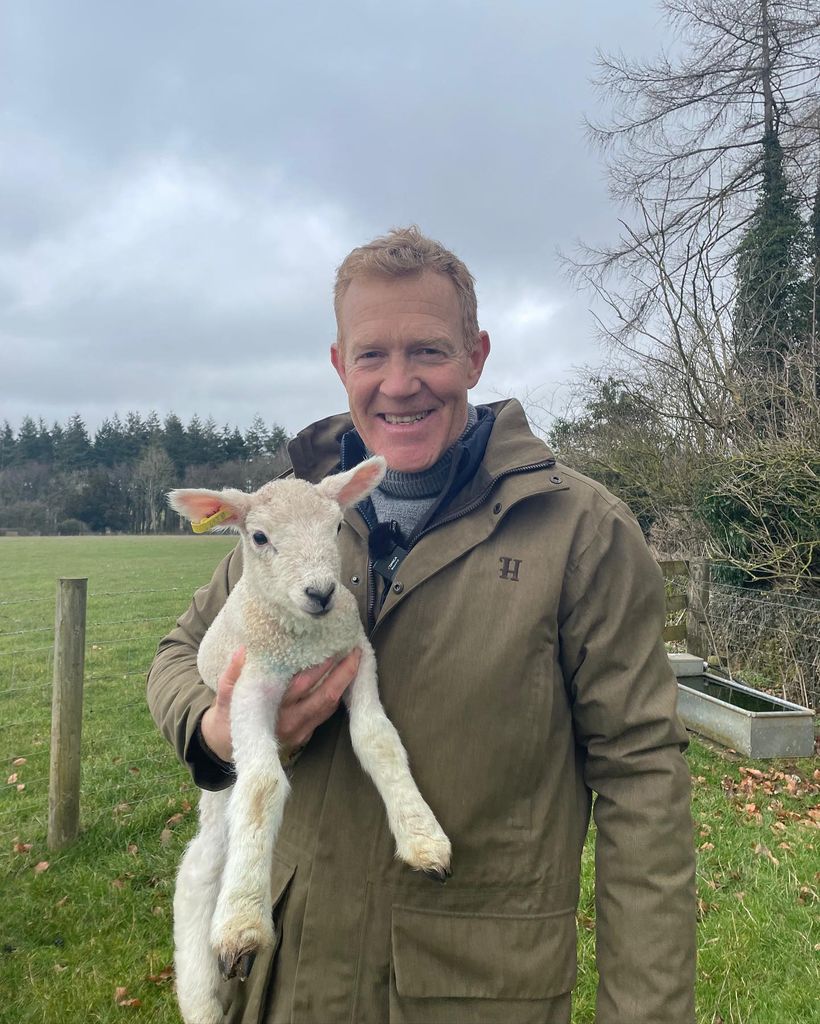 adam holding lamb