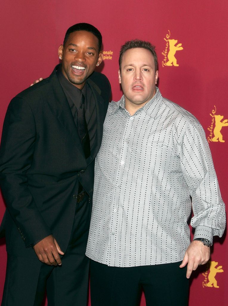 Will Smith and Kevin James pose at the "Hitch" Photocall
