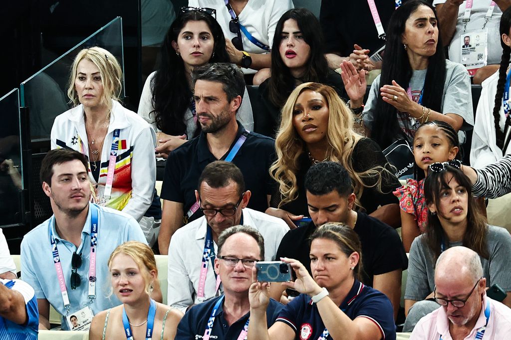 Serena Williams (second row C-R) and her daughter Olympia wait for the start of the artistic gymnastics women's team final during the Paris 2024 Olympic Games at the Bercy Arena in Paris, on July 30, 2024