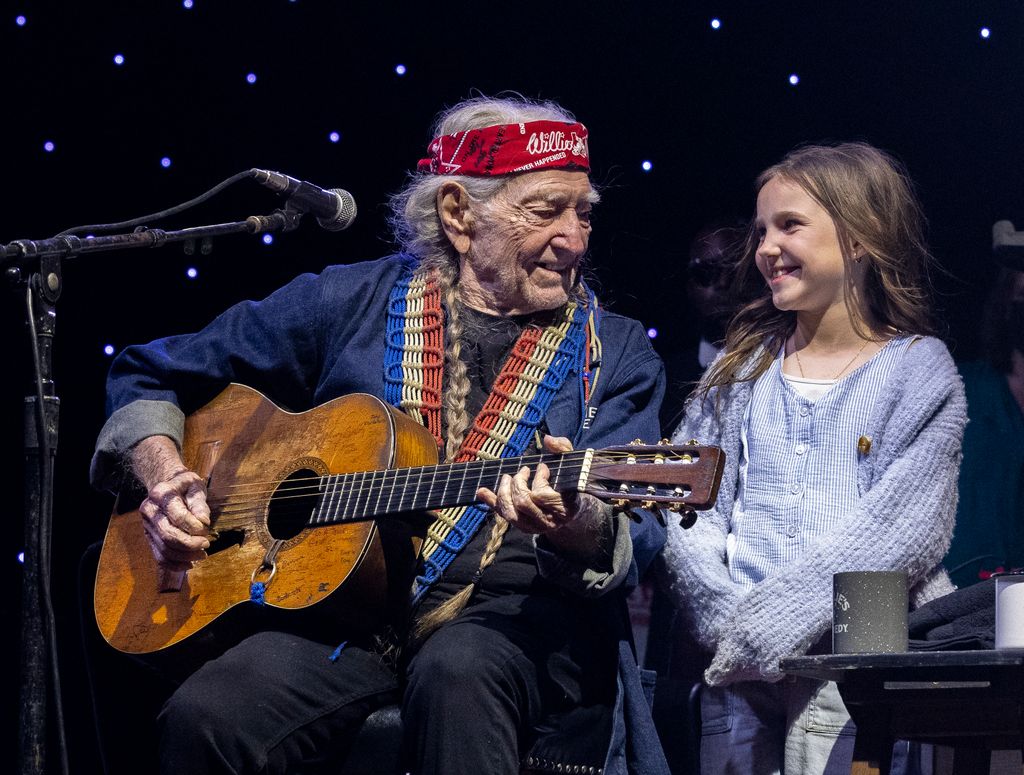 Willie Nelson (L) is joined onstage by Charlie Marie Selman during Luck Reunion at Luck Ranch