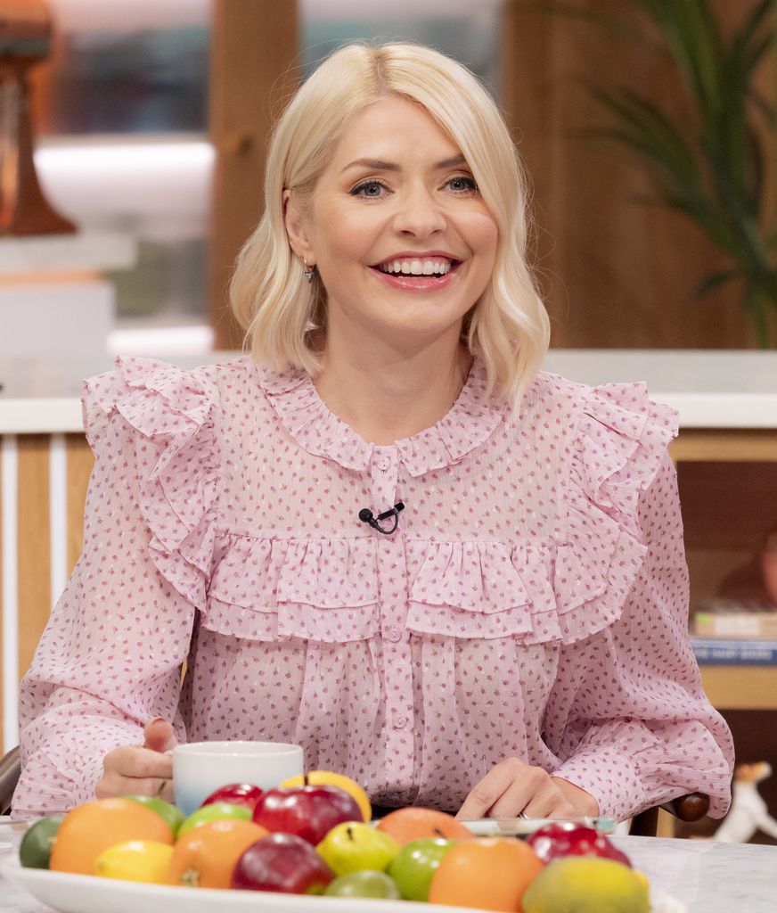 Holly Willoughby wears a pink floral blouse on This Morning