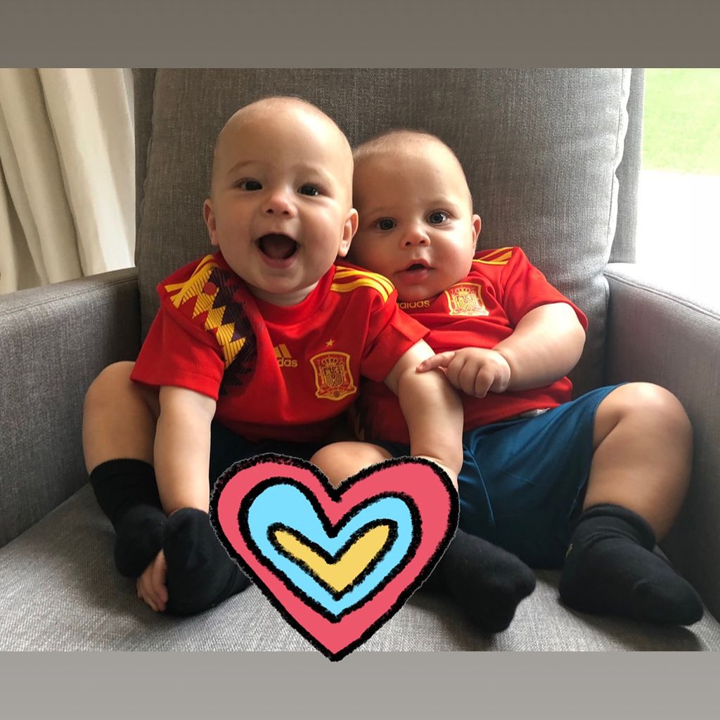 The twins as babies in football kits