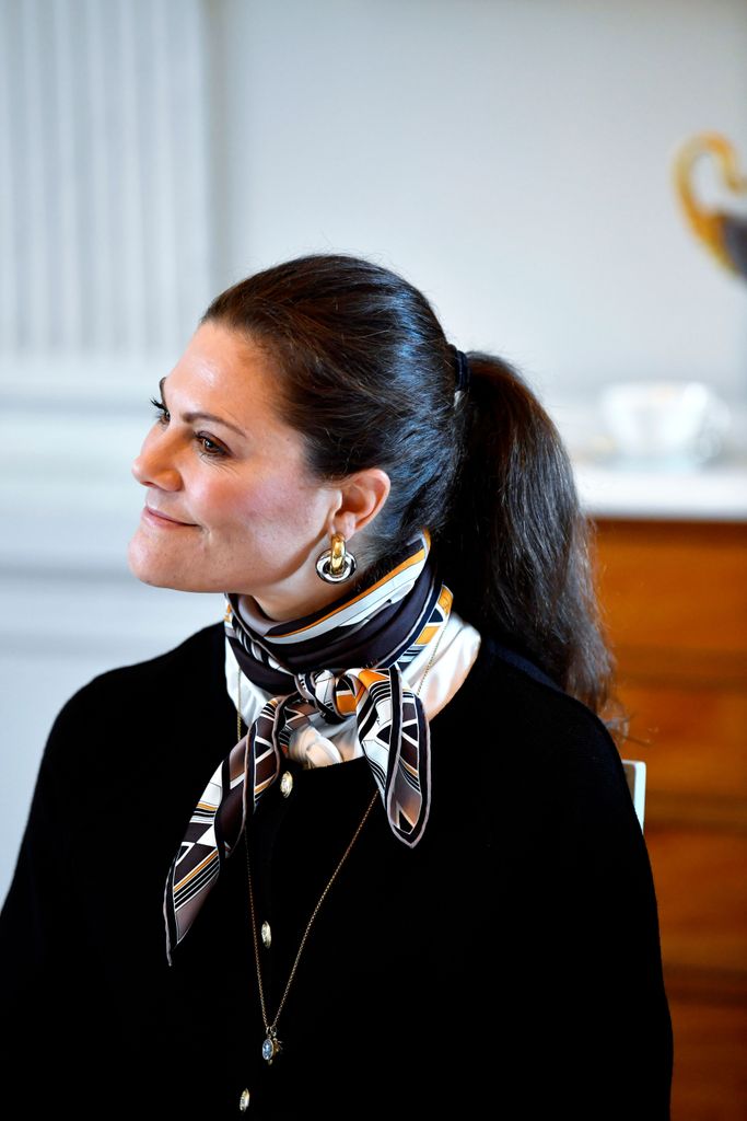 Crown Princess Victoria in black jumper and neck scarf