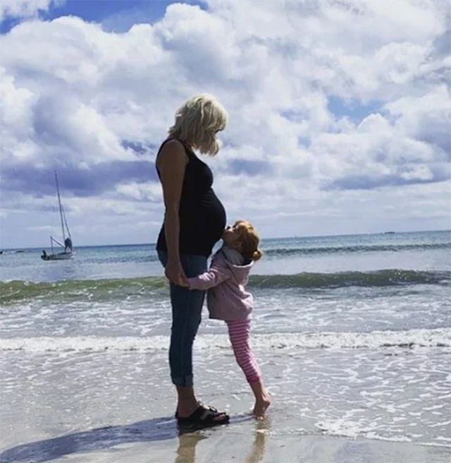 Helen George daughter kissing baby bump