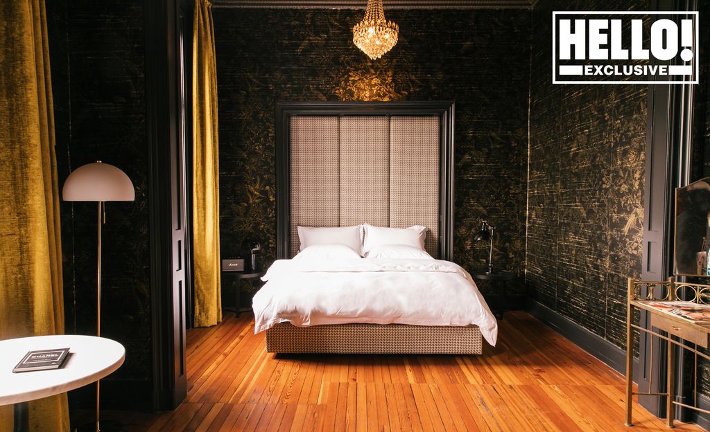 Bedroom with gold and black wallpaper