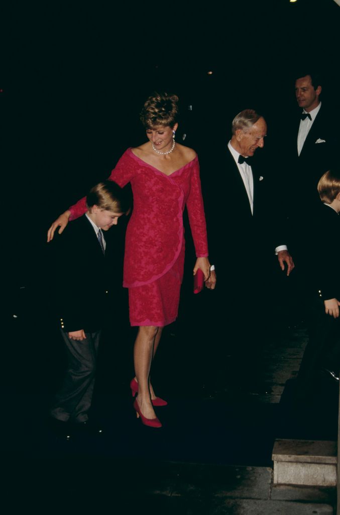 Diana, Princess of Wales, 1991 wears a pink sequin mini dress with matching heels and has her arm around her son Prince William