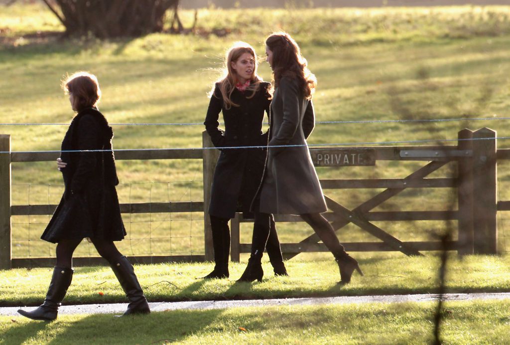 Kate Middleton and Princess Beatrice walk from Sandringham Church after an early Christmas Day service at Sandringham on December 25, 2011 in King's Lynn, England. 